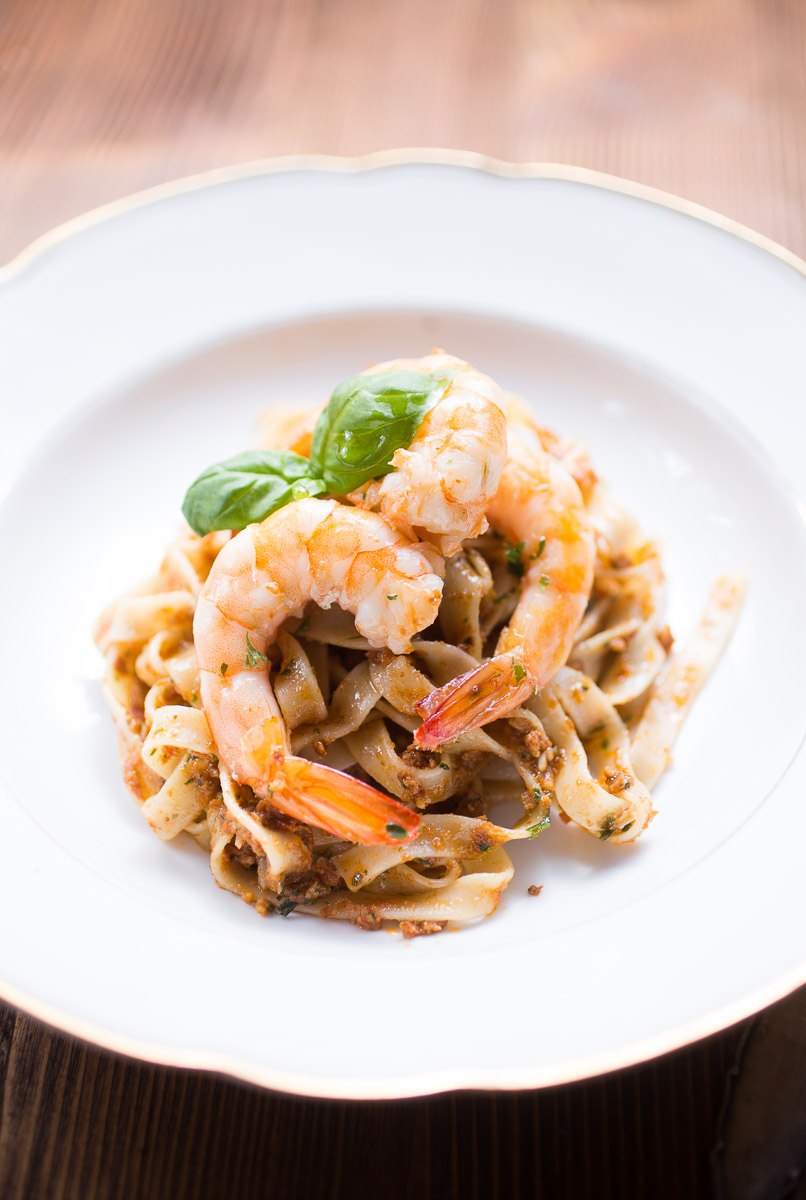 Tagliatelle with red pesto and king prawns