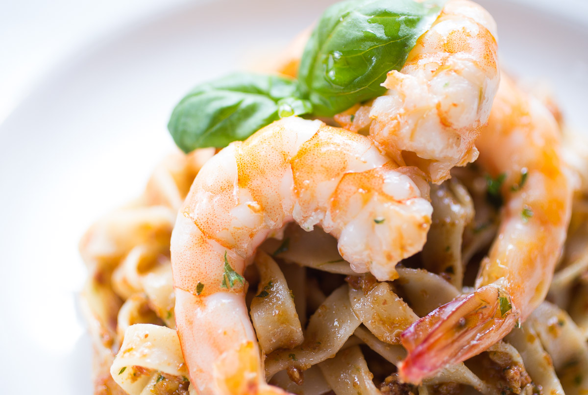 Tagliatelle with red pesto and king prawns