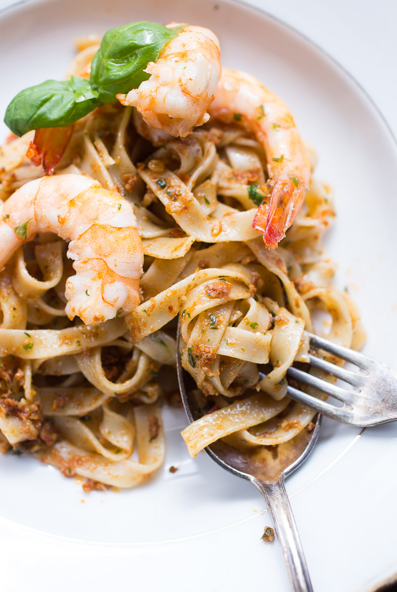 Tagliatelle with red pesto and king prawns