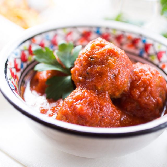 Feta filled meatballs in tomato sauce The Girl Loves To Eat